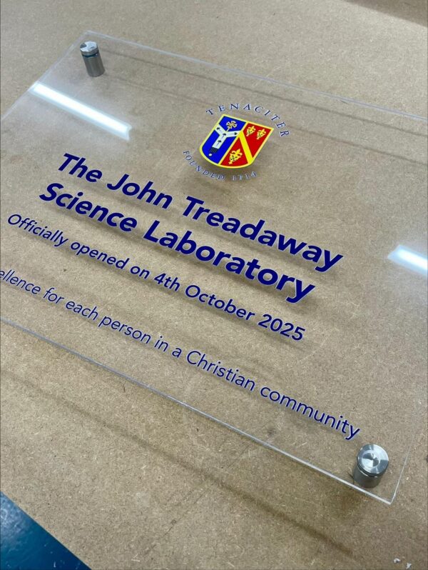Acrylic sign for John Treadaway Science Laboratory with logo and details.
