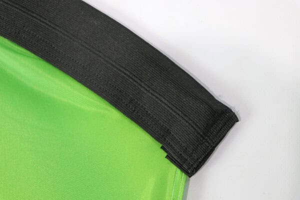 Close-up of teardrop flag base with black and green fabric.