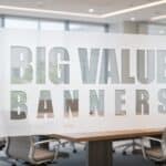 Big Value Banners logo on frosted glass office partition.